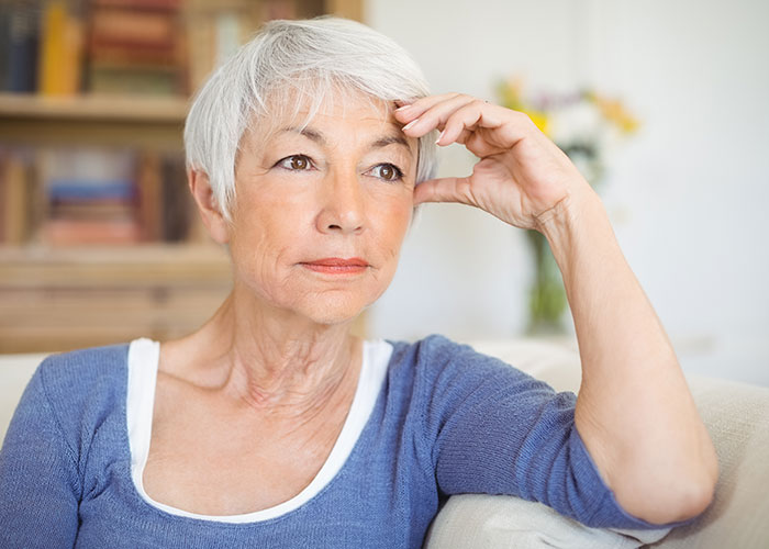 Elderly woman looking thoughtful and tired, reflecting on feeling stuck babysitting five kids at home. Elderly woman looking thoughtful and tired, reflecting on feeling stuck babysitting five kids at home.