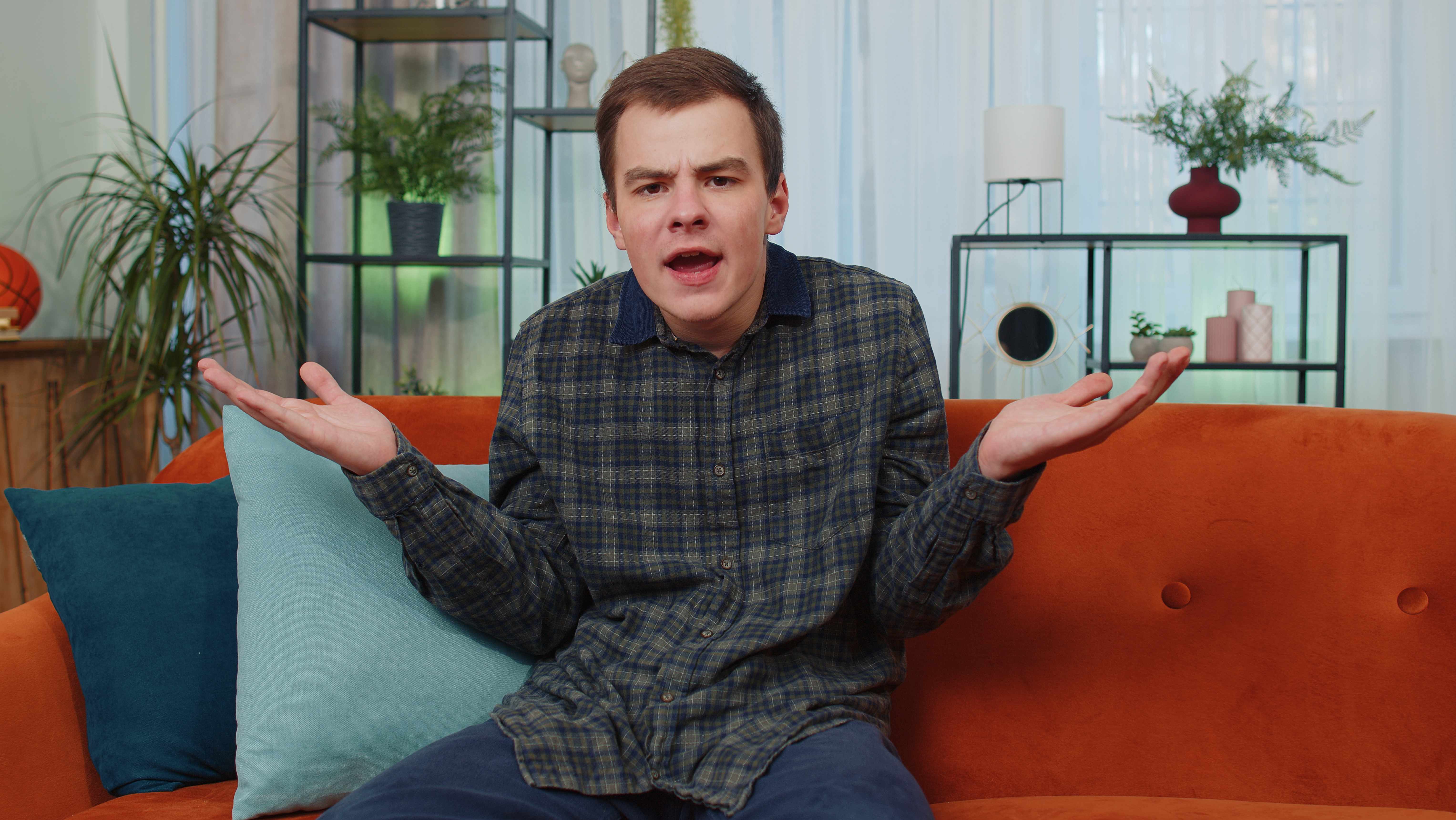 Young man frustrated at home, expressing shock and confusion about wife&rsquo;s lack of attraction, emphasizing servant treatment theme