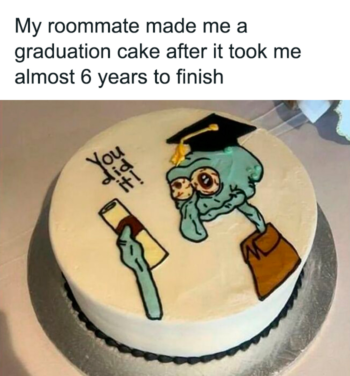 Graduation cake with funny cartoon character holding diploma, a sweet and wholesome pic to cleanse your feed.