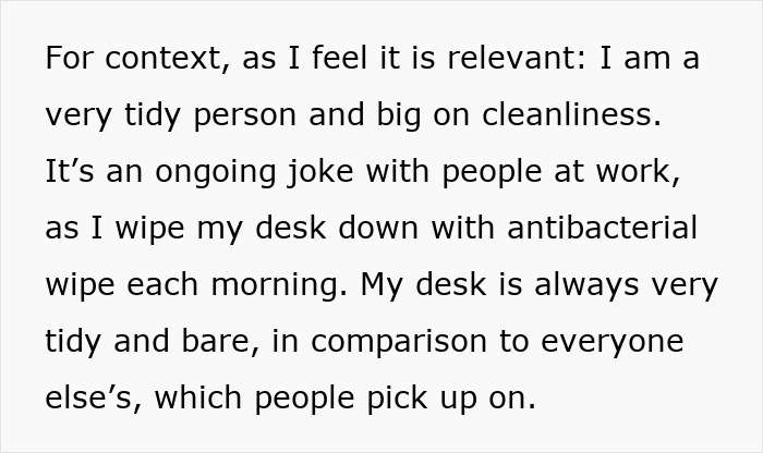 Woman standing confidently at office desk, ignoring social pressure from coworkers despite potential awkwardness. Woman standing confidently at office desk, ignoring social pressure from coworkers despite potential awkwardness.