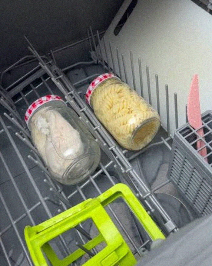 Two jars filled with pasta and food placed inside a dishwasher, illustrating cooking food in the dishwasher concept.