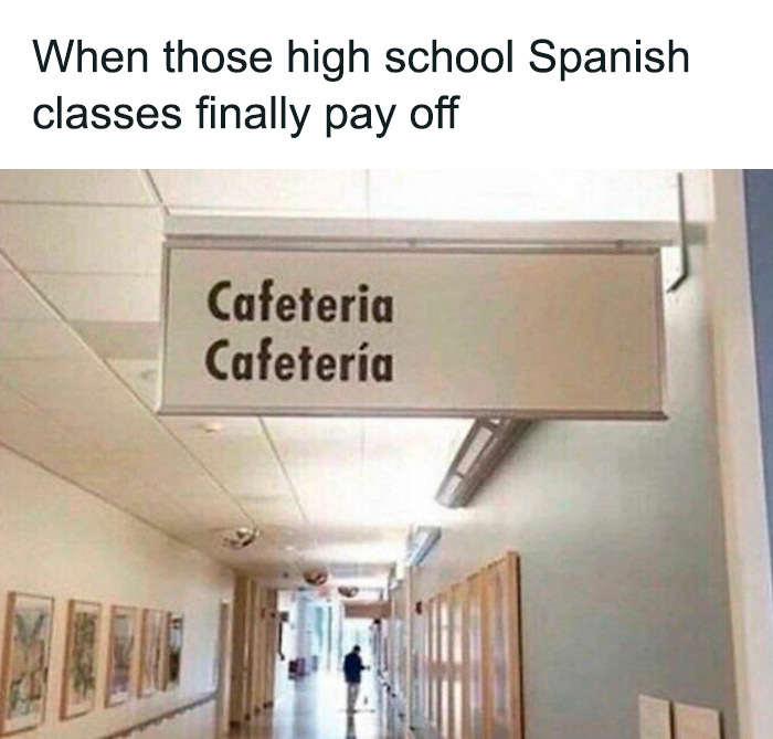 Bilingual cafeteria sign humorously highlights pointless things that serve no purpose except for being funny in a hallway setting.
