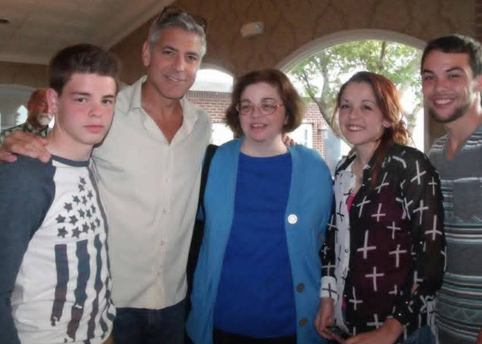 George Clooney with family members during a gathering, sharing a heartfelt tribute for his sister Ada.