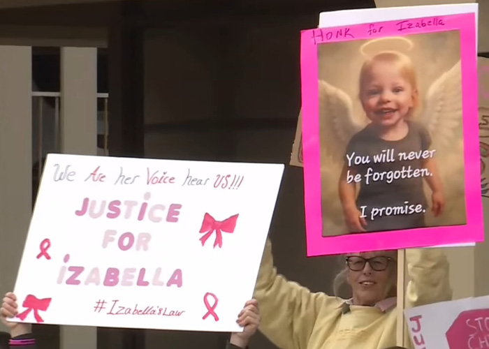 Protesters holding signs demanding justice for Izabella, highlighting mom&rsquo;s chilling Google searches amid slaying charges.