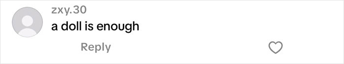 Screenshot of a social media comment saying "a doll is enough" related to Christmas gift haul for daughter backlash. Screenshot of a social media comment saying "a doll is enough" related to Christmas gift haul for daughter backlash.