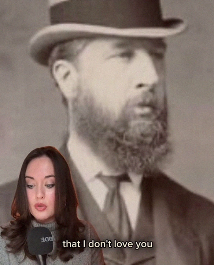Woman reading a letter from worst Victorian boyfriend with a vintage portrait of a bearded man wearing a hat in the background.