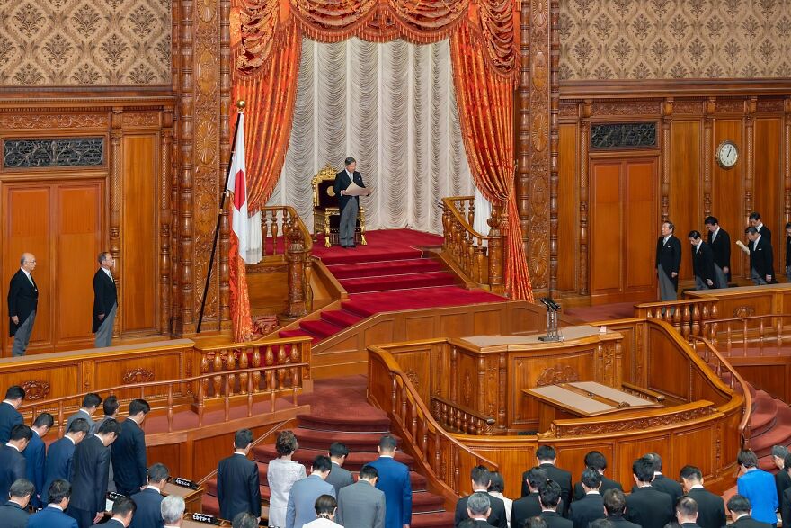 Japanese emperor seated on throne in ceremonial hall representing oldest surviving monarchies in the world