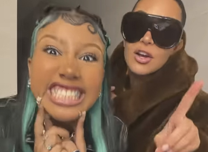 North West, 12, with bold hair and makeup, posing with a woman in oversized sunglasses and a fur coat.