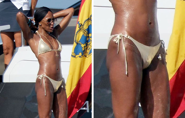 Woman in a gold bikini on a yacht showing a bizarre detail noticed in a celebrities photo at a sunny event