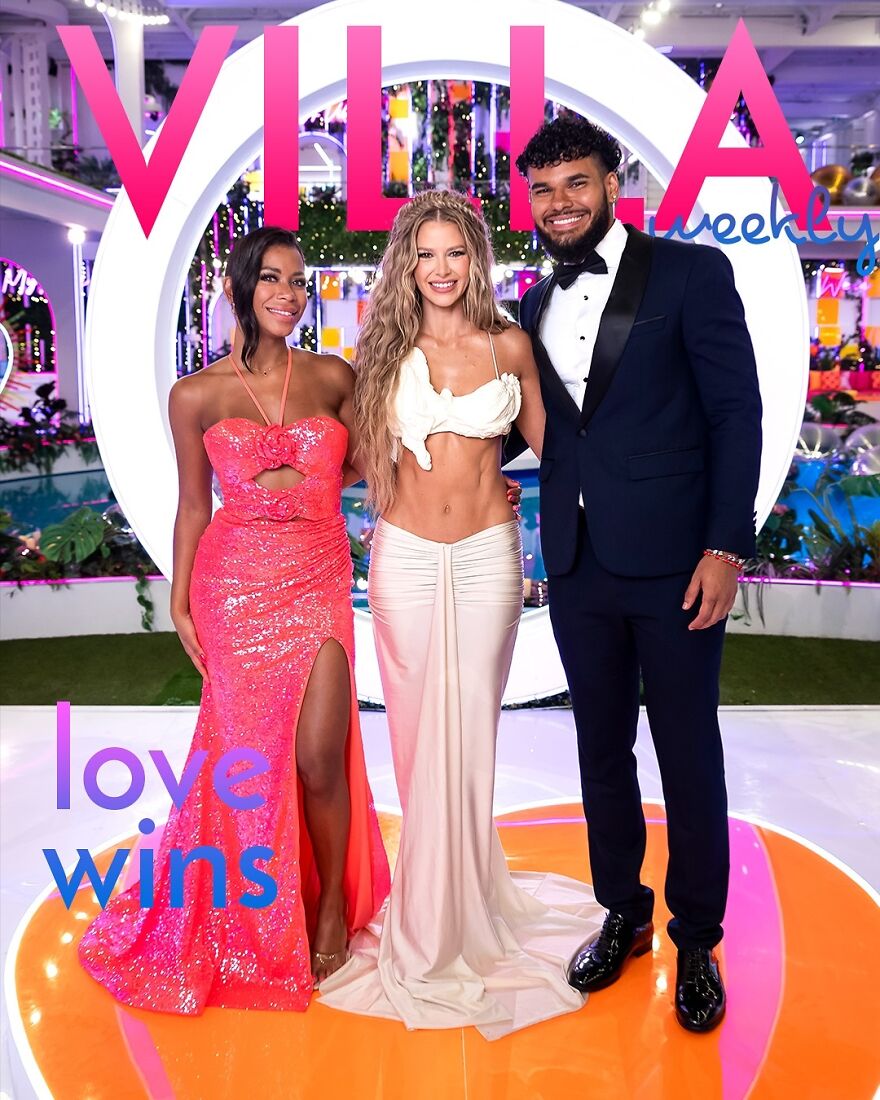 Three people dressed glamorously at a pop culture event with vibrant decor and Villa Weekly signage in the background.