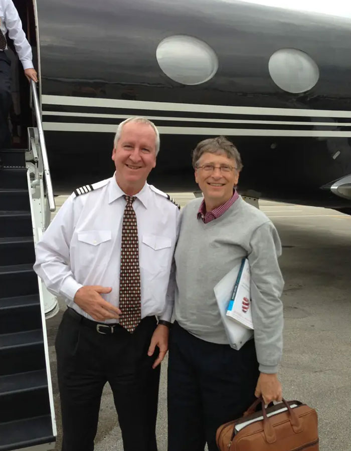 Two men smiling in front of a private jet, related to disturbing Epstein desk photo and new estate images released. Two men smiling in front of a private jet, related to disturbing Epstein desk photo and new estate images released.