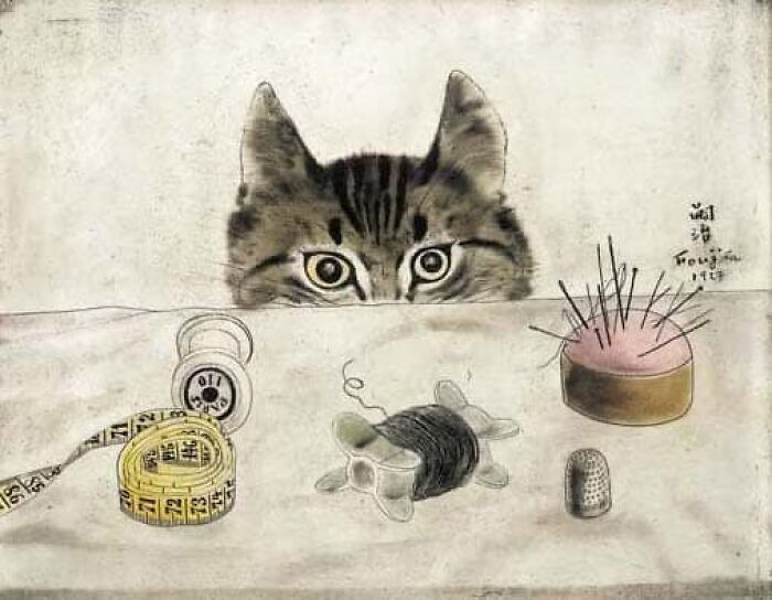 Vintage drawing of a cat peeking over a table with sewing tools, capturing emotion and everyday life in the past.