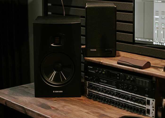 High-end audio equipment and speakers in a luxury industry studio setup showing costly tech that may be a rip-off.