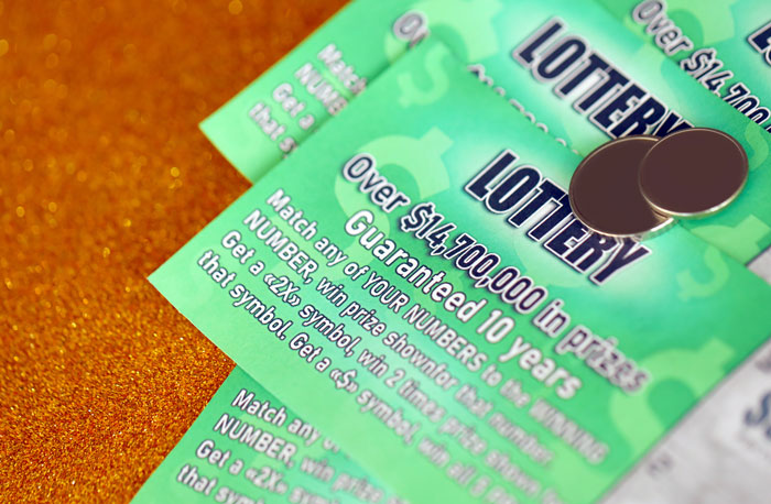 Close-up of lottery scratch-off tickets, a popular white elephant gift that sparks fun and friendly competition.