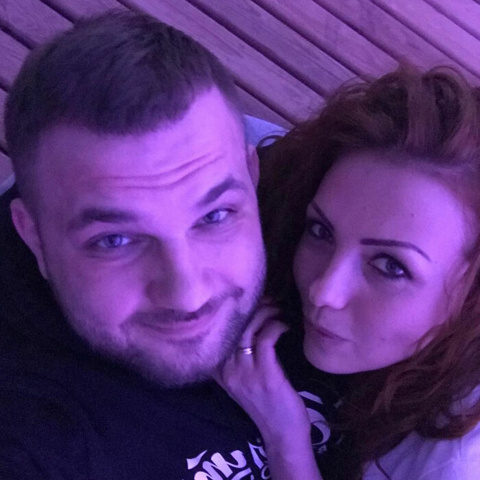 Man and woman close together in a dim purple light, related to crypto scammer case in Dubai mall. Man and woman close together in a dim purple light, related to crypto scammer case in Dubai mall.