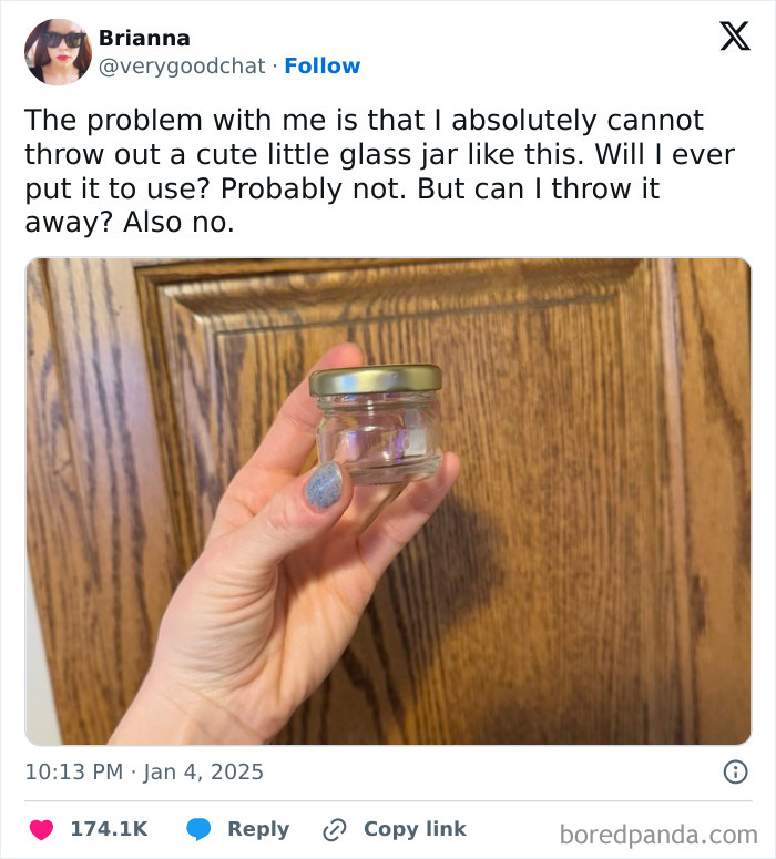Hand holding a small glass jar in front of wooden cabinet, illustrating relatable parenting humor from top tweets of 2025.