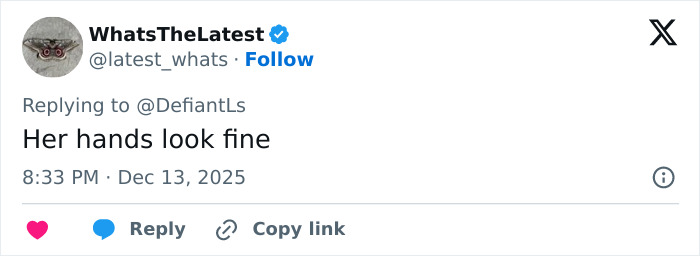 Screenshot of a Twitter reply stating her hands look fine, sparking debate about Cynthia Erivo's oddly large hands.