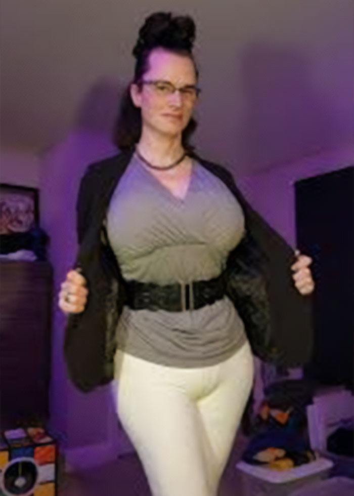 High school teacher posing indoors in a costume, sparking outrage among parents after photos went online.