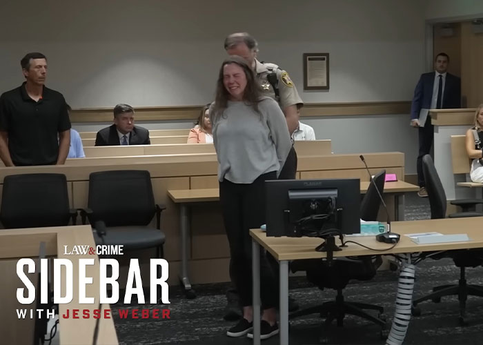 Woman sobbing in courtroom as engaged teacher faces consequences for sending 35K texts to student, escorted by sheriff's deputy.