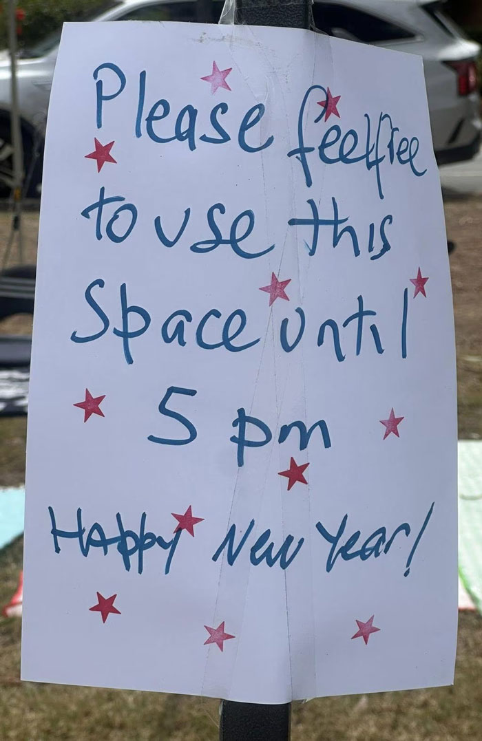Handwritten sign requesting public space use until 5 pm on New Year's Eve amidst controversy over reserving public space. Handwritten sign requesting public space use until 5 pm on New Year's Eve amidst controversy over reserving public space.