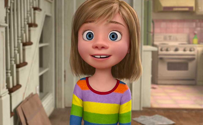 Animated character of Andy&rsquo;s mom from Toy Story standing in a kitchen wearing a colorful striped shirt.