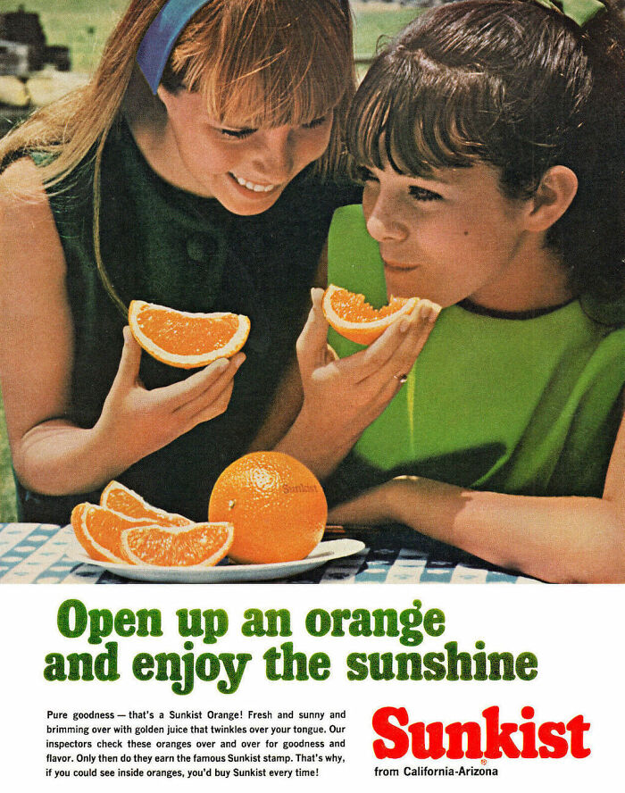 Two girls enjoying fresh orange slices in a vintage ad showcasing marketing of Sunkist oranges.