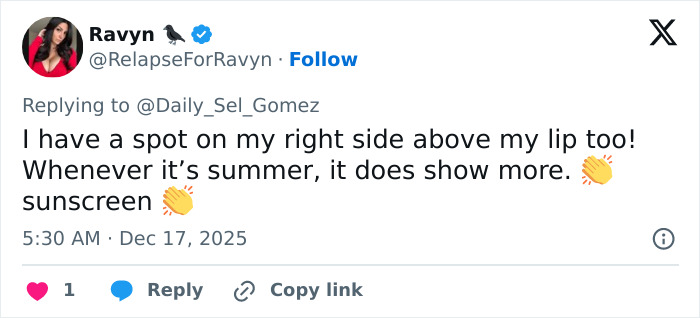 Tweet reply discussing a spot above the lip and mentioning summer and sunscreen related to Selena Gomez mustache.