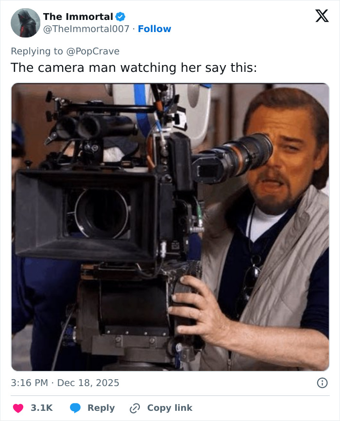 Leonardo DiCaprio operating film camera with intense focus, relating to Jennifer Lawrence's dating history remarks.