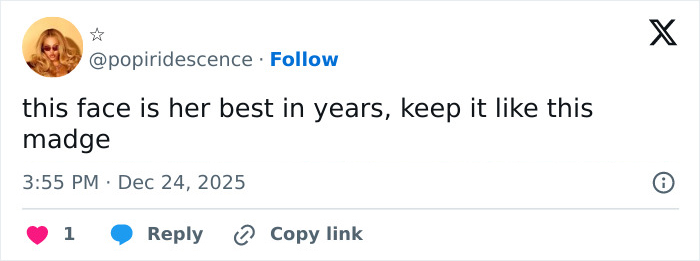 Tweet praising Madonna's holiday lingerie photoshoot, highlighting her appearance amid photoshop frenzy online.