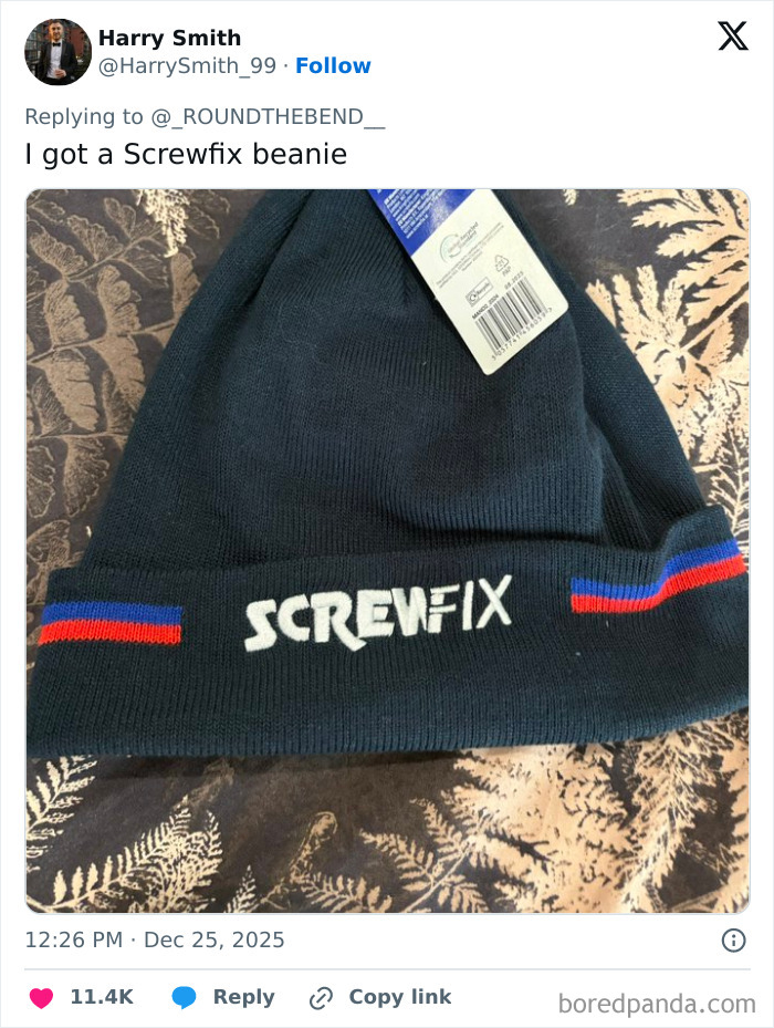Black Screwfix beanie with blue and red stripes, an example of one of the worst Xmas presents people received this holiday.