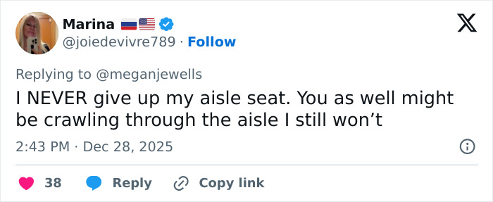 Tweet from user Marina stating she never gives up her aisle seat amid internet divided over man punishing woman for seat switch on flight.