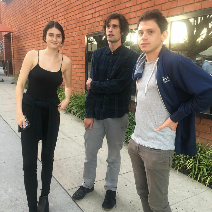 Romy Reiner with two young men outside, highlighting new details about Rob Reiner&rsquo;s daughter and brother Nick.