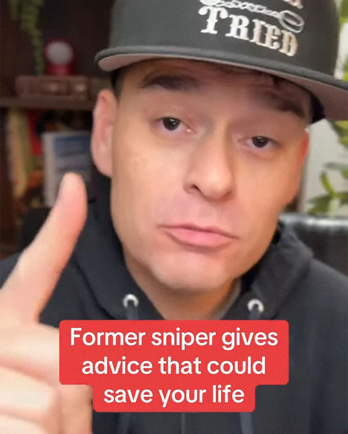 Man wearing cap and hoodie sharing mass shooting survival tips that could save your life in a close-up video frame. Man wearing cap and hoodie sharing mass shooting survival tips that could save your life in a close-up video frame.