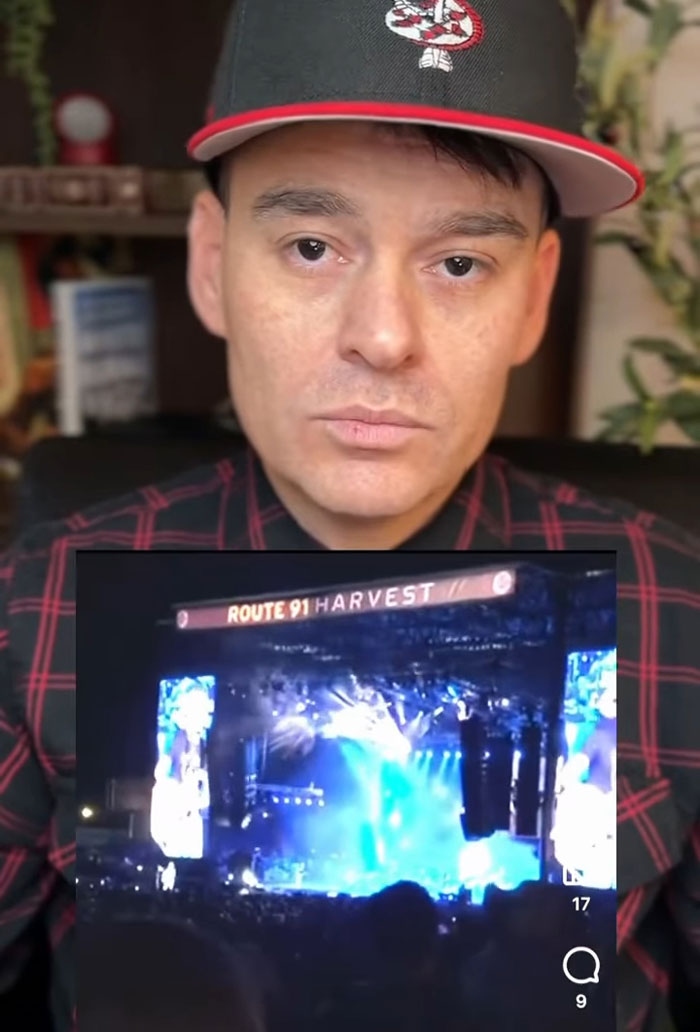 Man wearing a baseball cap discusses mass shooting survival tips with an image of a concert stage in the background. Man wearing a baseball cap discusses mass shooting survival tips with an image of a concert stage in the background.