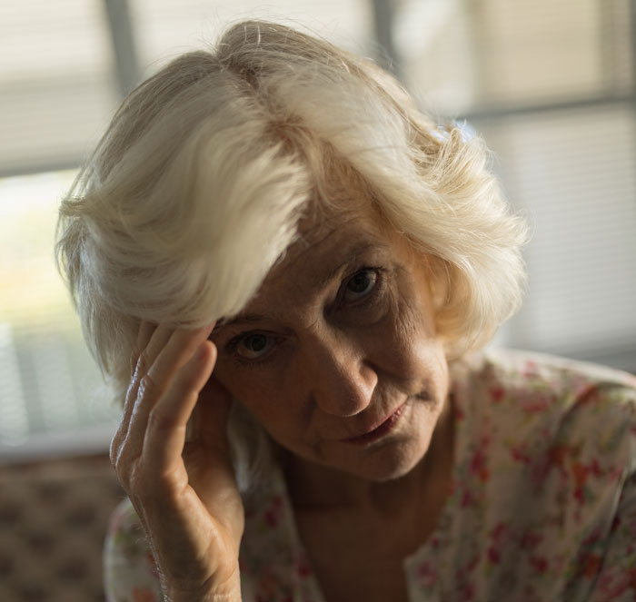 Elderly woman looking distressed indoors, highlighting women ruining MIL’s surprise by pretending ignorance. Elderly woman looking distressed indoors, highlighting women ruining MIL’s surprise by pretending ignorance.