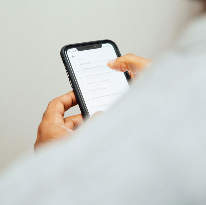 Person holding smartphone, scrolling through messages related to couples revealing the toughest things they forgave.