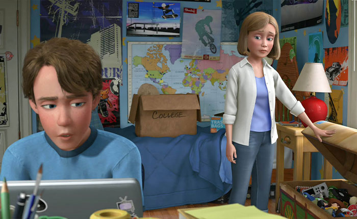 Andy&rsquo;s mom from Toy Story standing beside Andy in his bedroom with a box labeled college in the background.