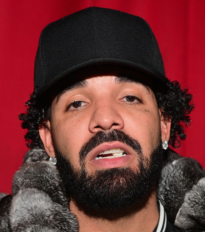Close-up of a male star wearing a black cap and fur coat, featured among the 50 most disliked stars this year.