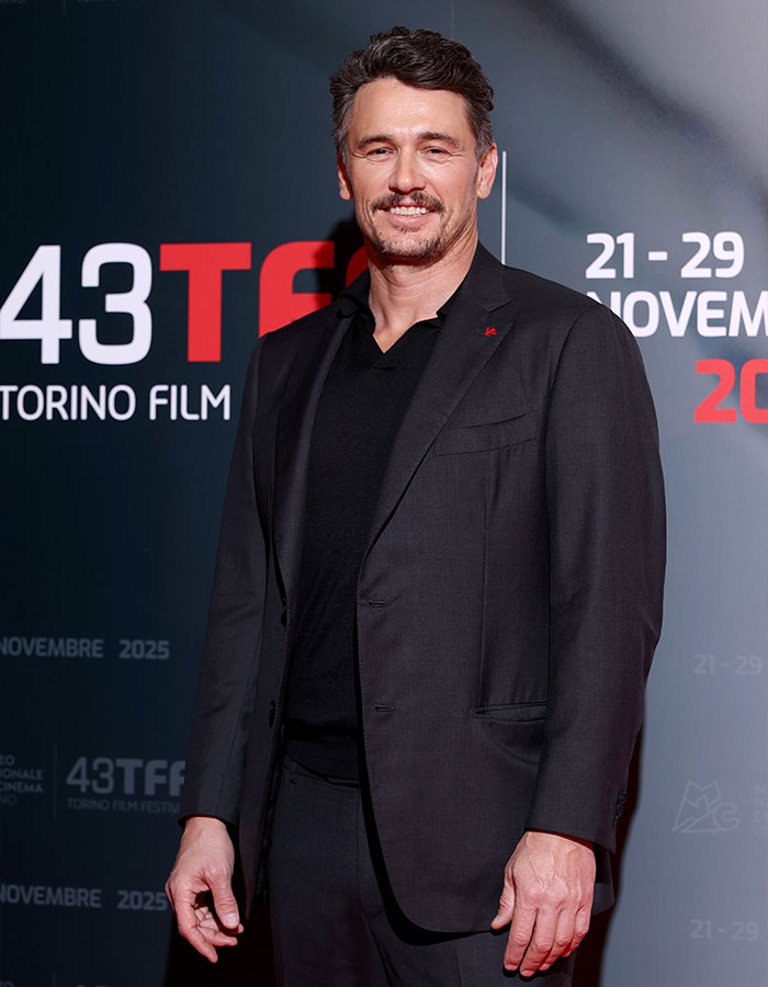 James Franco smiling at a film festival event, dressed in a black suit, reflecting on Hollywood experiences. James Franco smiling at a film festival event, dressed in a black suit, reflecting on Hollywood experiences.