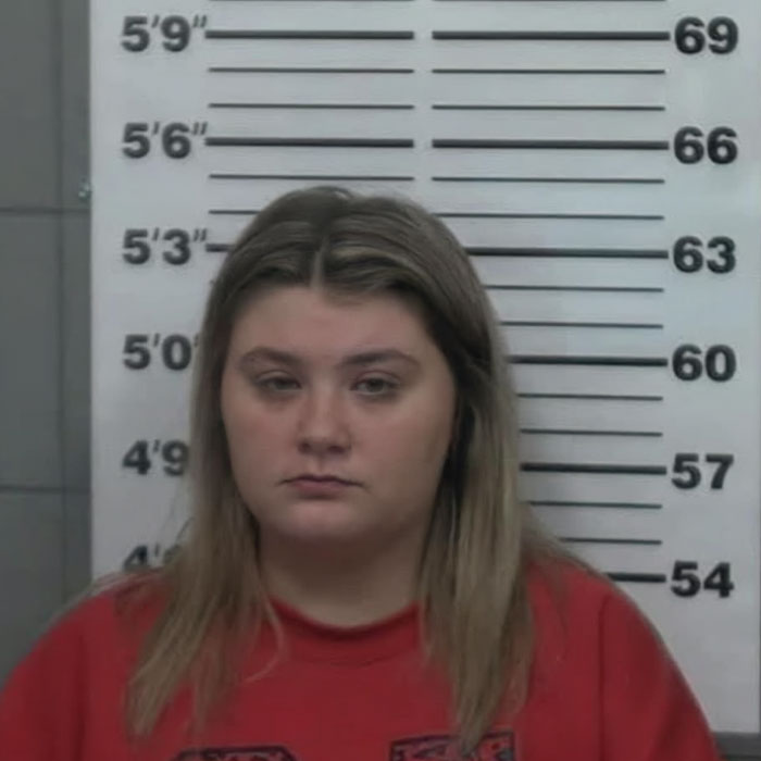 Mugshot of beauty queen accused in toddler&rsquo;s passing case, appearing in court with a different look than before.