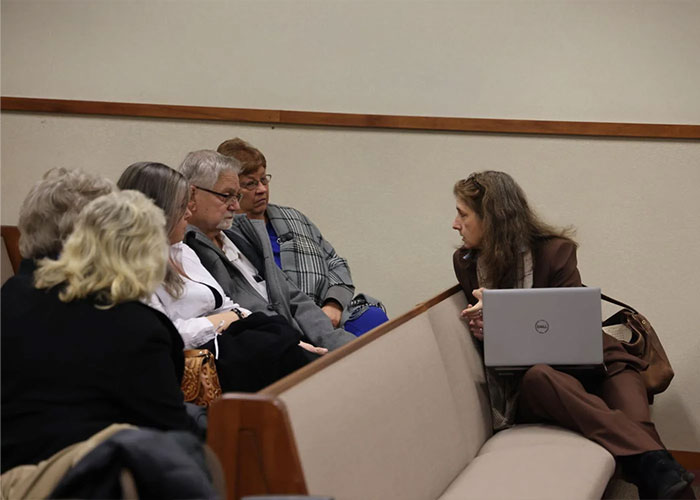 Group of people in a serious discussion inside a room, related to child kidnapped from Kentucky found alive case. Group of people in a serious discussion inside a room, related to child kidnapped from Kentucky found alive case.