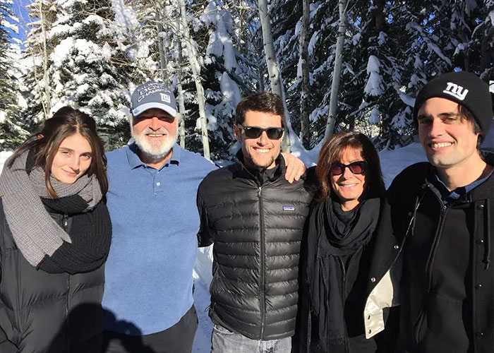 Group of five people outdoors in winter clothing with snowy trees in the background related to Trump controversy over Rob Reiner and wife. Group of five people outdoors in winter clothing with snowy trees in the background related to Trump controversy over Rob Reiner and wife.