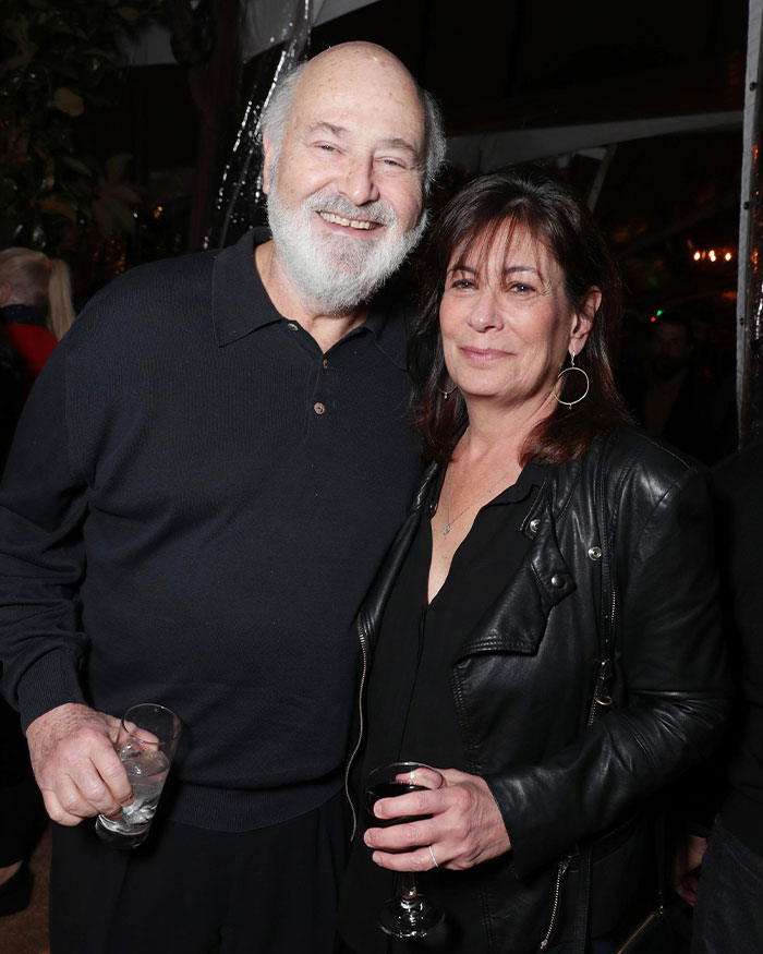 Man and woman smiling at an event, with focus on Nick Reiner and a startling diagnosis before homicides.