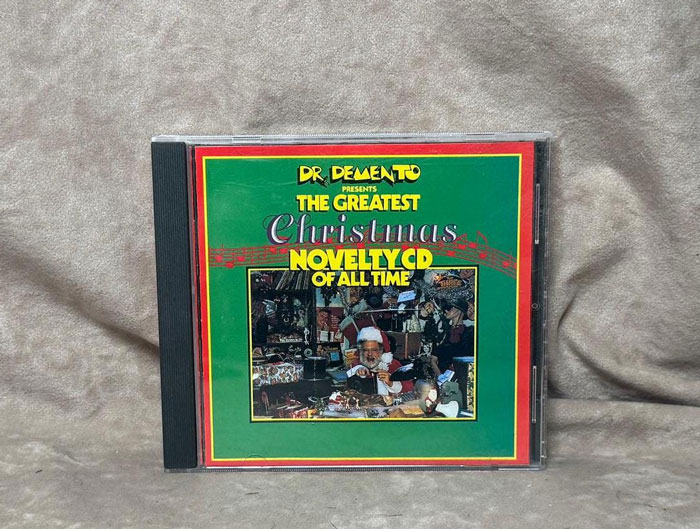 CD case of Dr. Demento's greatest Christmas novelty CD, a popular white elephant gift often stolen at parties.
