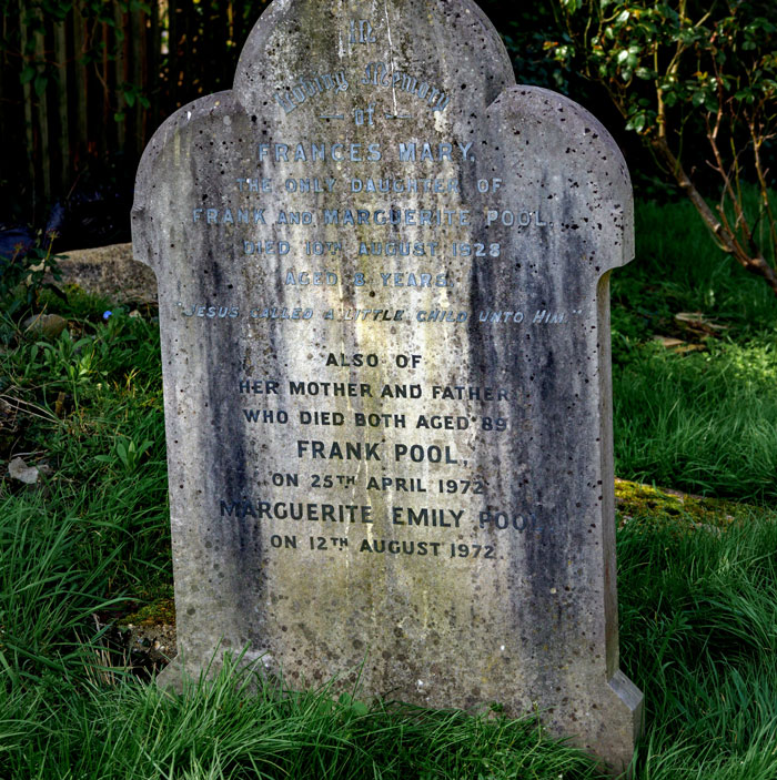 Old weathered tombstone covered in moss in the woods, evoking eerie feelings for people who couldn't sleep for days.