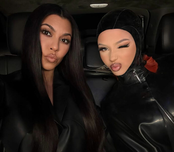 Kourtney Kardashian and Travis Barker posing together in dark attire, facing backlash for intimate gift involving his daughter.