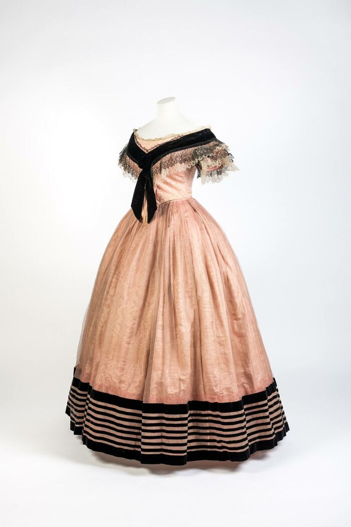 Victorian-era dress on a mannequin showcasing culture and everyday life in the past through a powerful old photo.