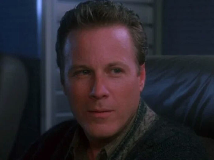 Man sitting in a dimly lit room, relating to Macaulay Culkin addressing Kevin&rsquo;s dad&rsquo;s job theory in Home Alone.