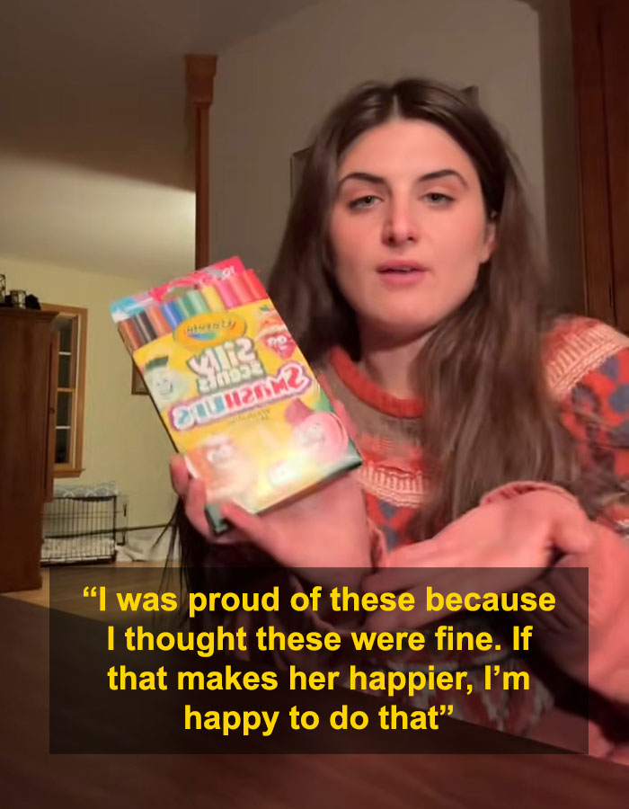 Woman holding dollar store items, responding to backlash over child's Angel Tree haul gift choices in a home setting.