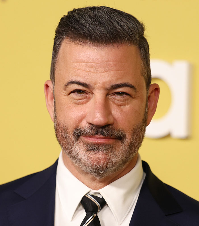 Male celebrity with salt and pepper beard and suit, representing one of the most disliked stars of this year voted by people.